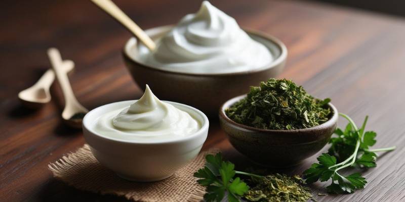 A freshly made DIY face mask using yogurt and dried parsley, displayed next to small bowls of the ingredients